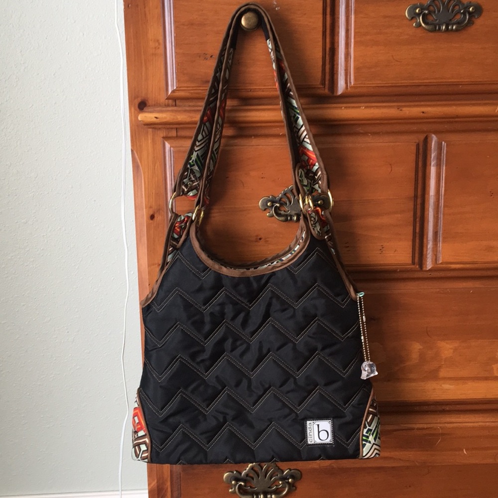 Black w/ pattern interior cinda b purse